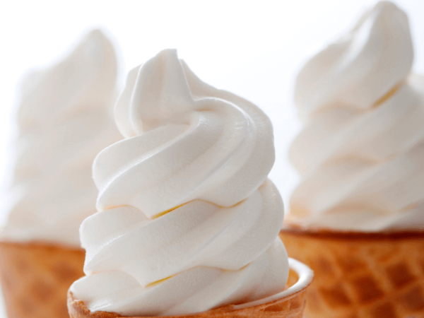 close up of three cones of vanilla soft serve mix